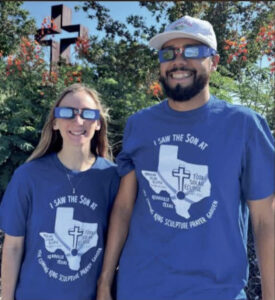Couple wearing TCKF Eclipse T-shirts