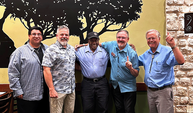 Group of Men Standing and Smiling