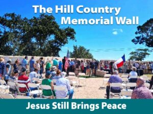 People line up against the limestone Flood Memorial Wall in prayer with Title Borders on image